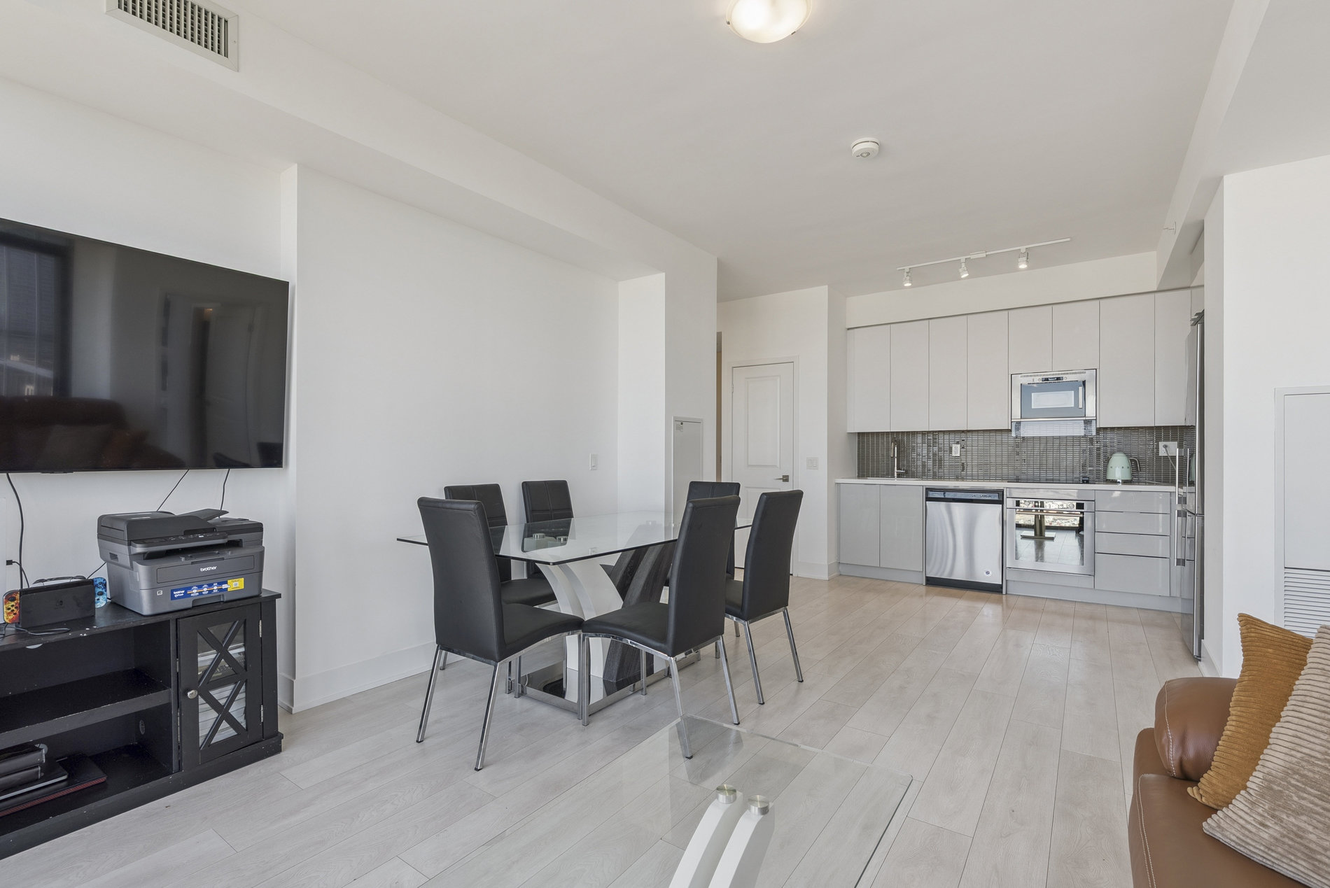 Living and dining area with kitchen view