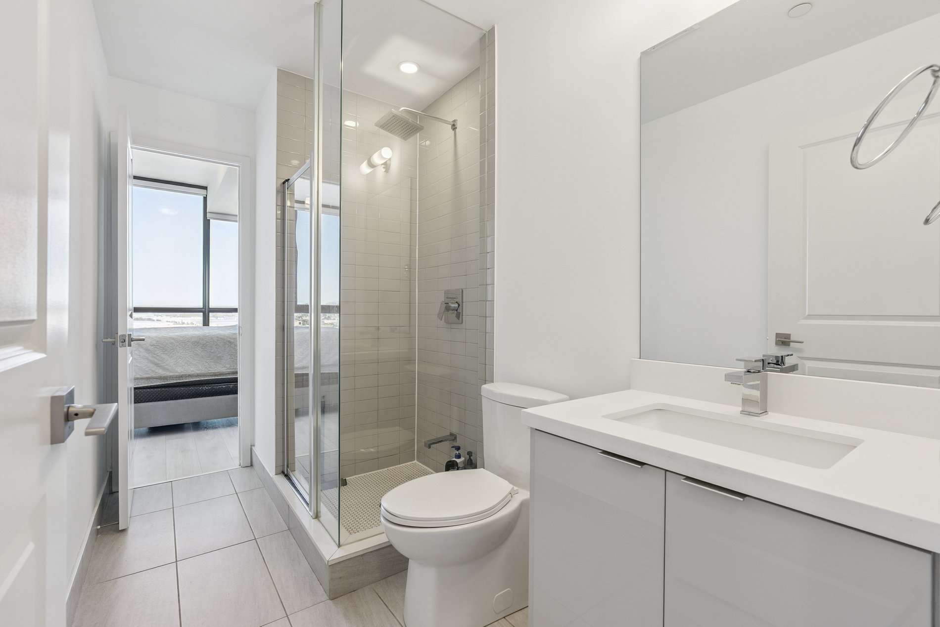 Ensuite bathroom with glass shower and modern vanity