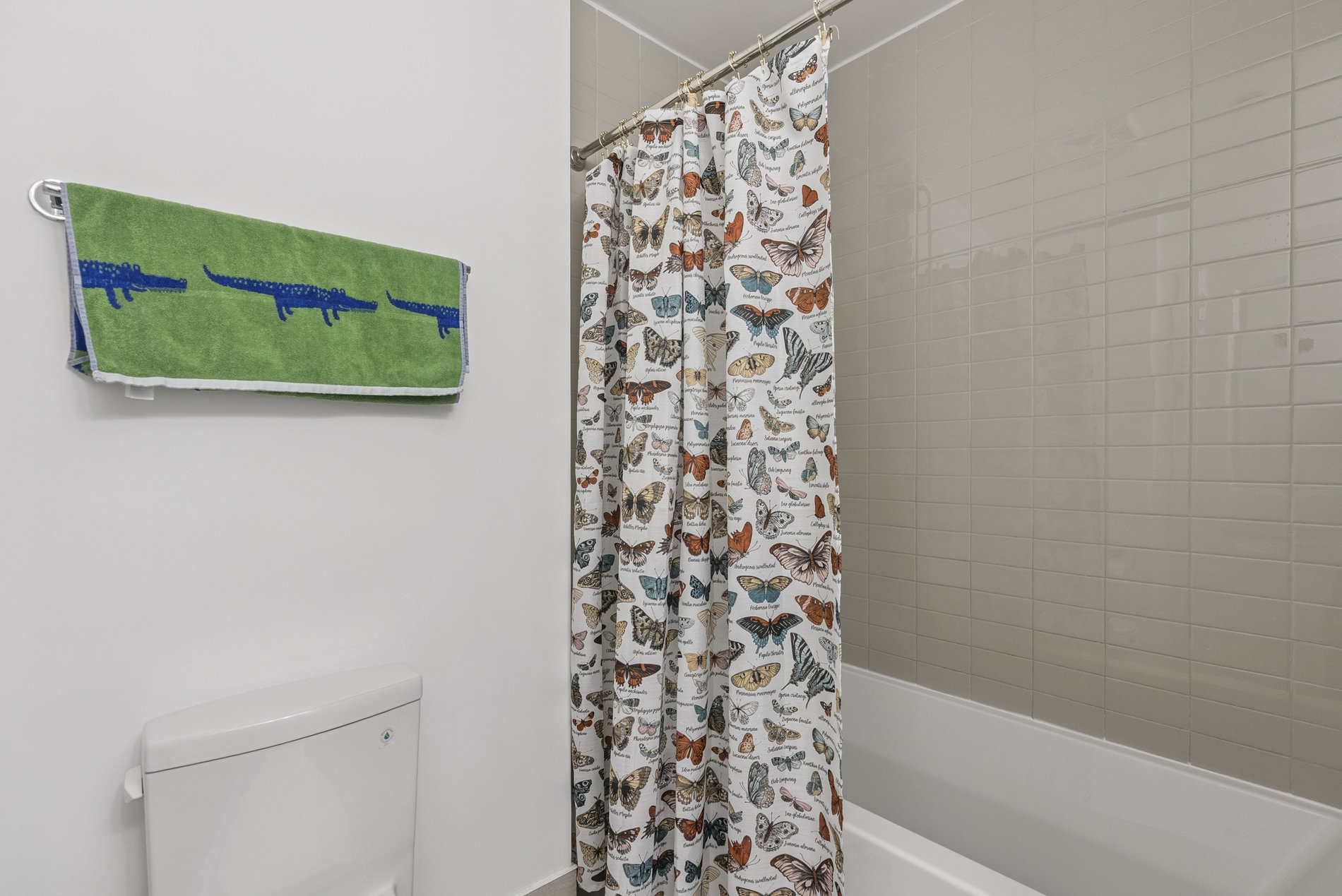 Bathroom with tub and shower curtain