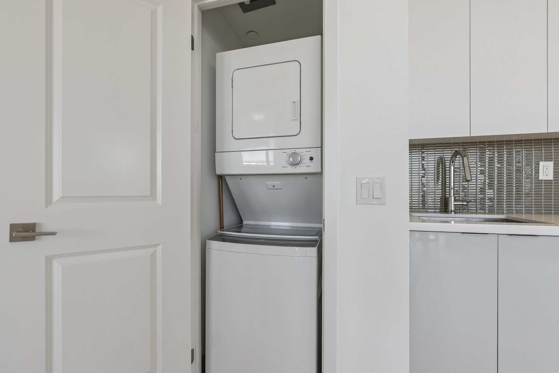 In-suite stacked washer and dryer