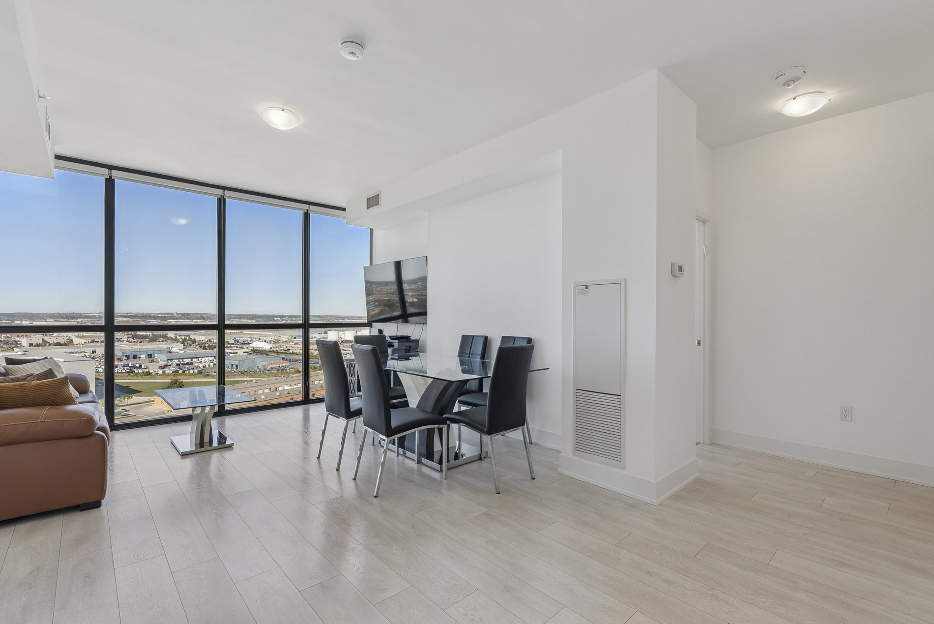 Living and dining area with city views