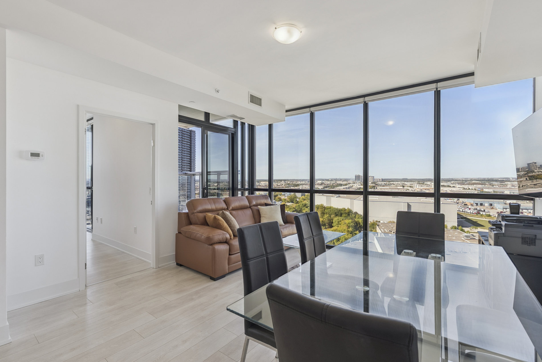 Corner living room with open skyline views