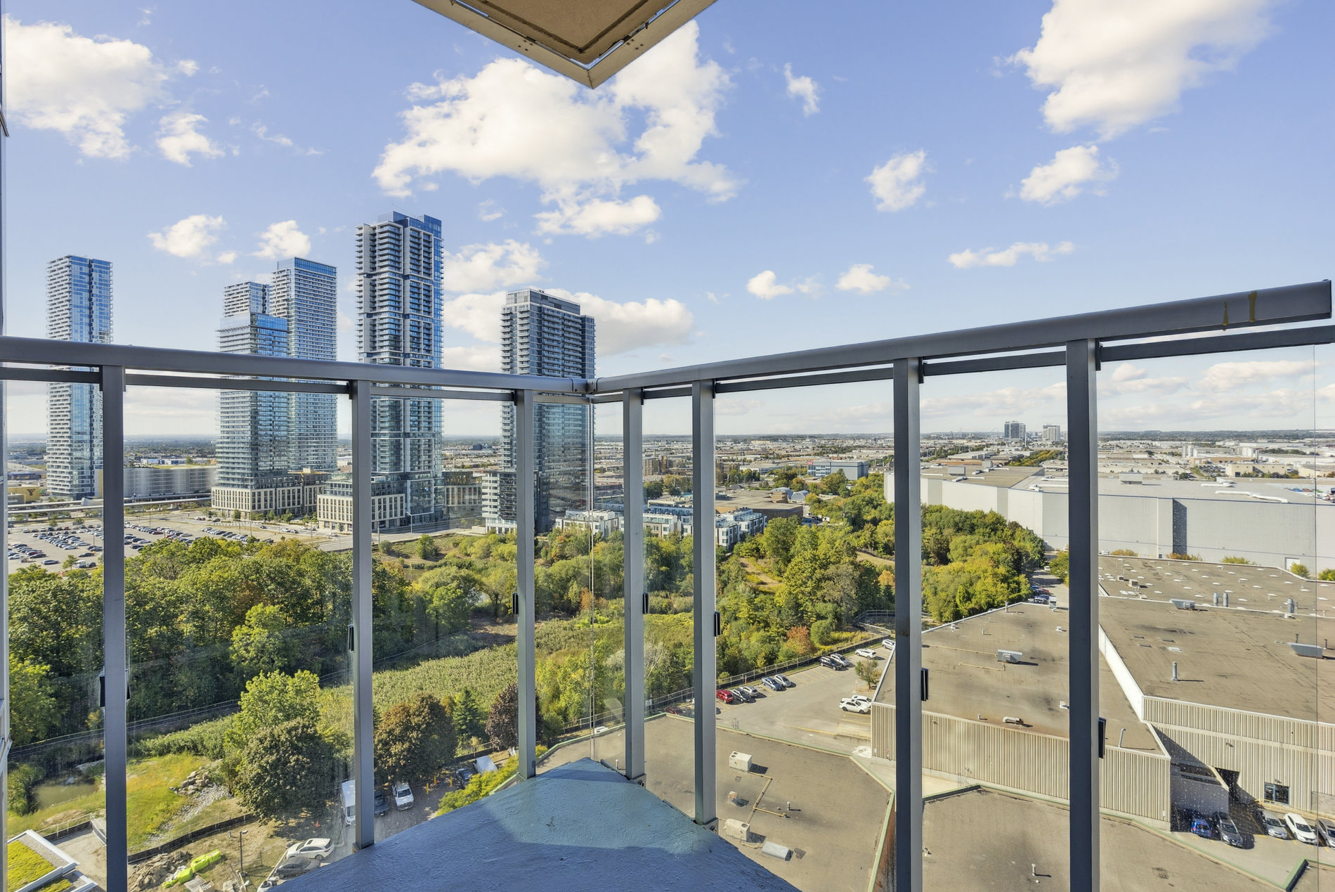 Corner balcony with open skyline and city views